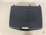 a close up of a black plastic box on a floor