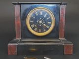 a clock that is sitting on a table with a key