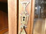 a close up of a door handle on a wooden door