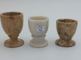 three small vases sitting next to each other on a table