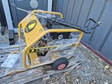 a yellow machine that is sitting on a pallet