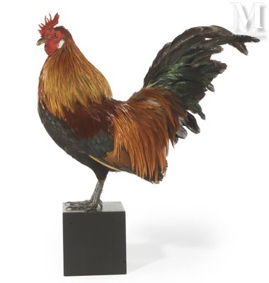a statue of a rooster standing on a black base