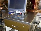 an image of a kitchen with a computer on the counter