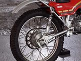 a red motorcycle that is parked on the street