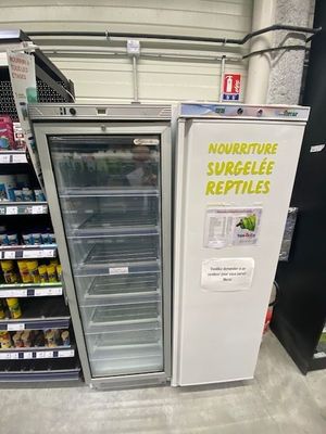 a refrigerator that is sitting in the middle of a store
