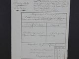 an old document with writing on it on a black surface