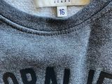 a close up of a t - shirt with a label on it