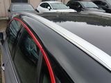 many cars parked in a parking lot next to each other