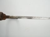 a person holding a knife in their right hand