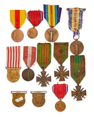 an assortment of medals and medals are displayed on a white surface