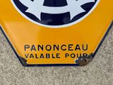 a yellow sign with a black and white design on it