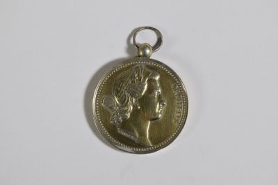 l'image d'une pièce d'argent sur laquelle figure le visage d'une femme