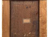 an old picture of a wooden picture frame with a tag on it