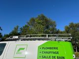 a white van with a green sign on the side of it