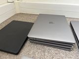 three laptops sitting on the floor next to each other