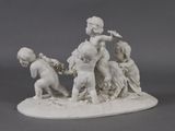 a figurine of a boy and a girl on a horse
