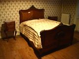 a bed that is in a room with a wooden frame