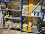 several shelves with various items on them in a room