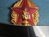 a red star on top of a blue uniform