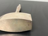 a small metal object that is on a table