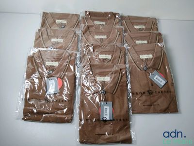 six bags of brown t - shirts sitting on top of a table