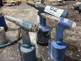 two air tools that are sitting on a table