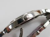 a close up of a wrist with a watch on it