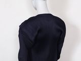 the back view of a mannequin dress with pleaed sleeves