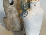 two vases sitting next to each other on a table