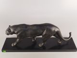 bronze sculpture of a panther on a black marble base