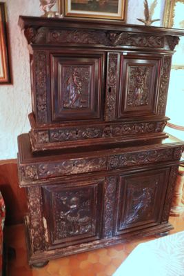 a large wooden cabinet in the corner of a room