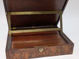 an old wooden box with a brass handle on a white background