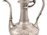 an antique silver tea pot with a handle on a white background
