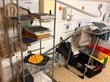 a room with a bunch of items on the shelves