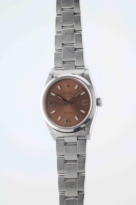 an image of a close up of a wrist watch on a white surface