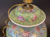 an image of a colorful vase with a lamp on top of it