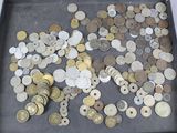 a lot of coins in a black box on a table