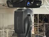 a television mounted to the ceiling of a building