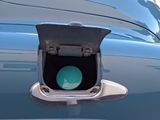 a close up of a green traffic light on a blue car
