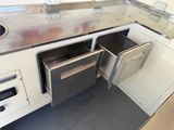 an image of a kitchen with a sink and a dishwasher
