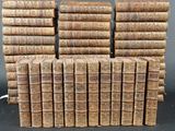 several stacks of books stacked on top of each other on a table
