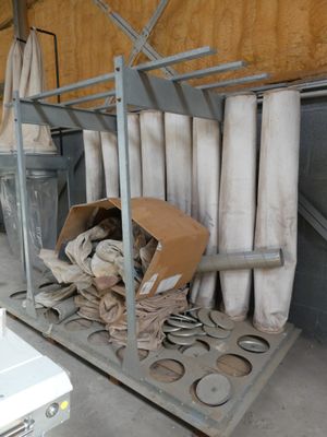 a pile of toilet paper on a cart in a room