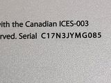 an image of a close up of a laptop computer with the text, with the canadian ces - 003 approved serial c7njmg0