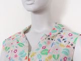 an image of a mannequin wearing a dress with flowers on it