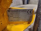 a close up of a sign on a yellow machine