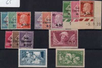 several different colored stamps on a black surface with a white tag