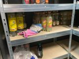 many bottles of soda and other beverages on the shelves