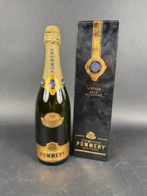 a bottle of pommery champagne next to a box