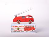 a red toy fire truck sitting on top of a box