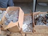 two boxes of assorted glasses on a table
